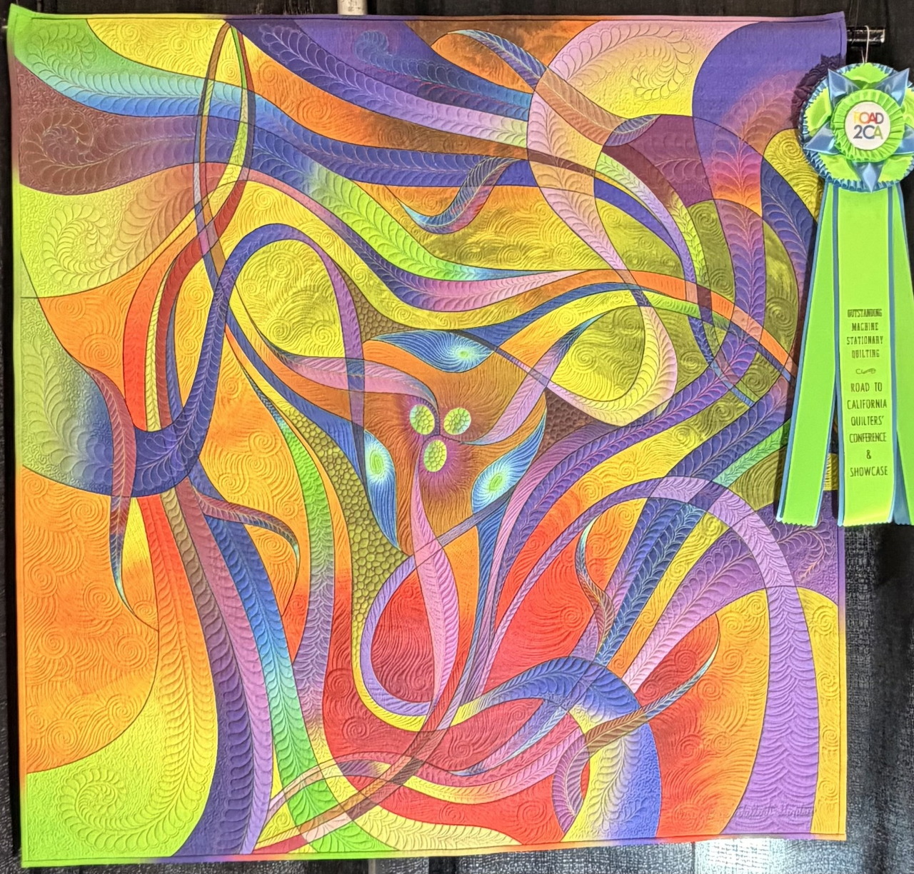 Colorful abstract art with swirling curved lines and a ribbon award on the right