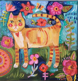 Folk art painting of orange cat with flowers and patterns on blue background