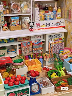 Miniature grocery store with shelves of tiny food products, produce bins, and vintage packaging