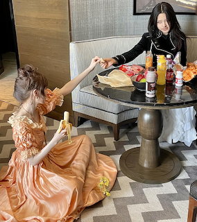Girls Sharing Snacks Indoors