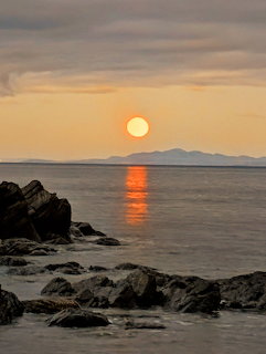 Sunset Over Ocean Rocks