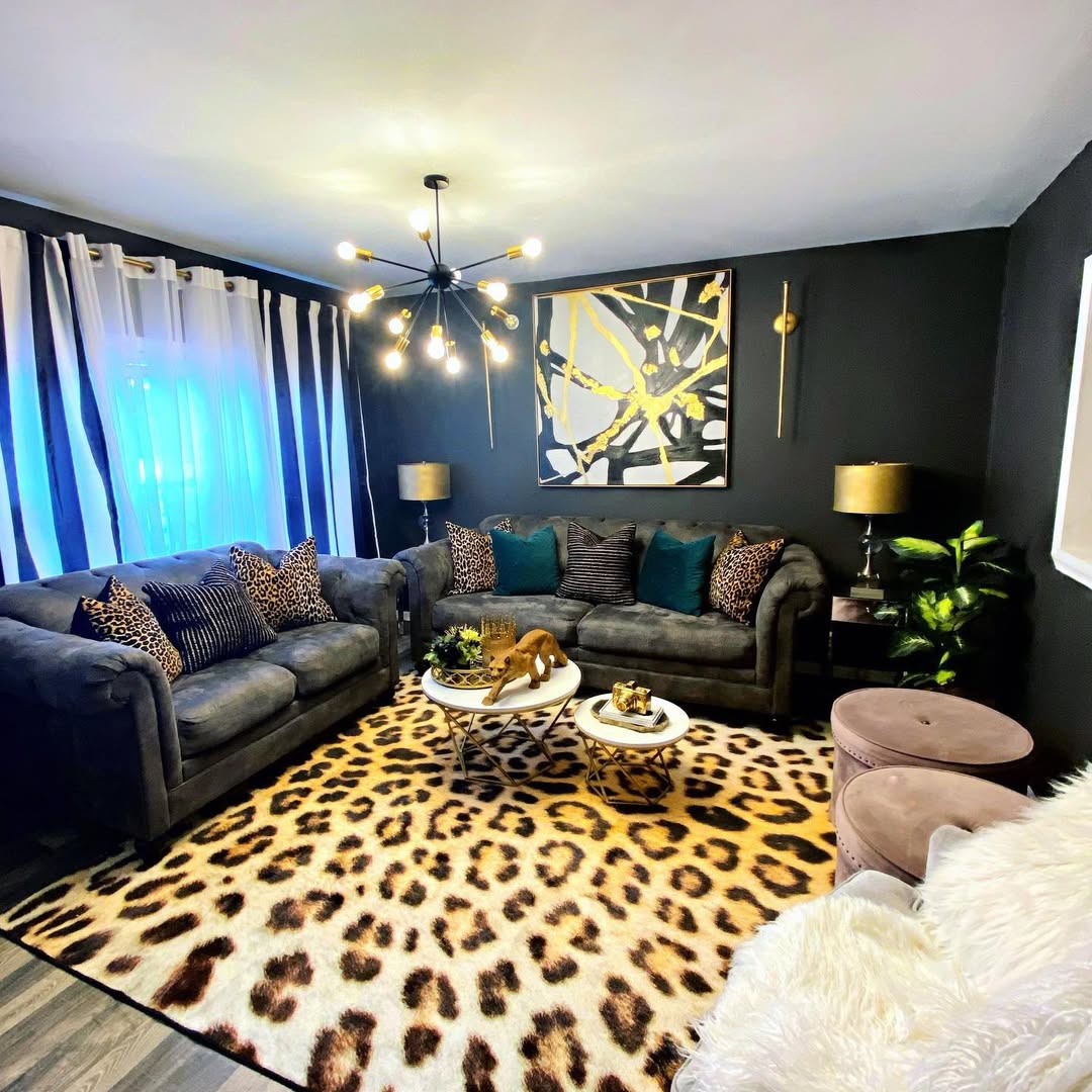 Modern living room with gray sofas and a leopard print rug on the floor