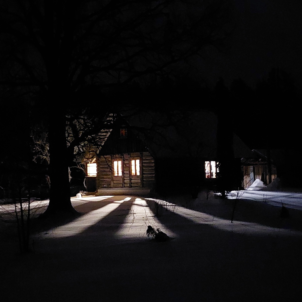 Snowy Cabin at Night