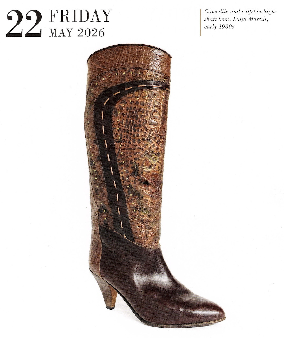 Brown leather cowboy boot on a white background with calendar text in the top left