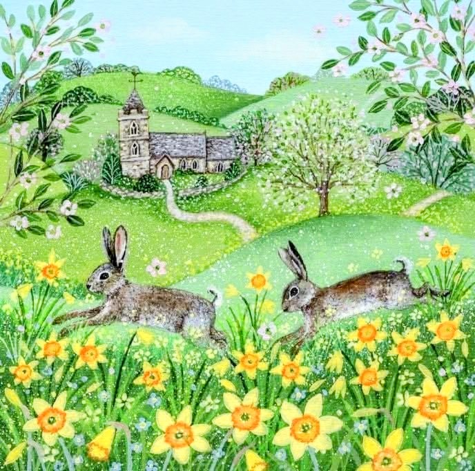 Two rabbits in a field of daffodils with a cottage and green hills behind them