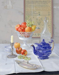 Still life painting with a blue teapot, fruit bowl, candle, and knife on a white tablecloth