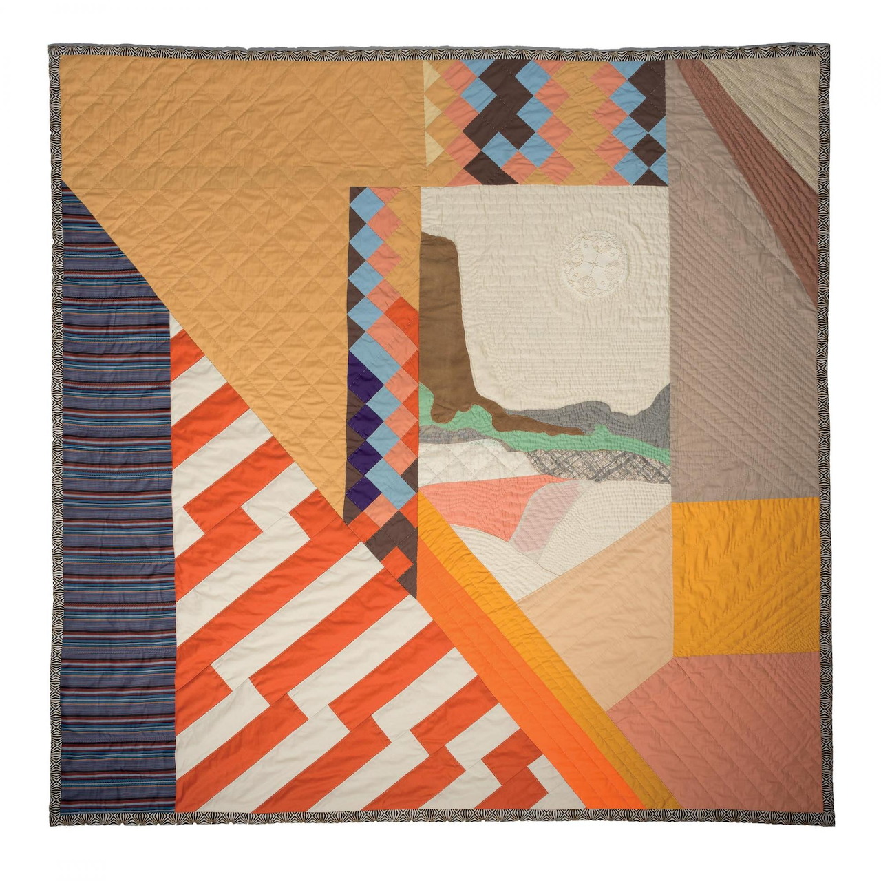 Abstract geometric quilt with zigzag patterns, stripes, and angular shapes in orange, brown, and cream tones