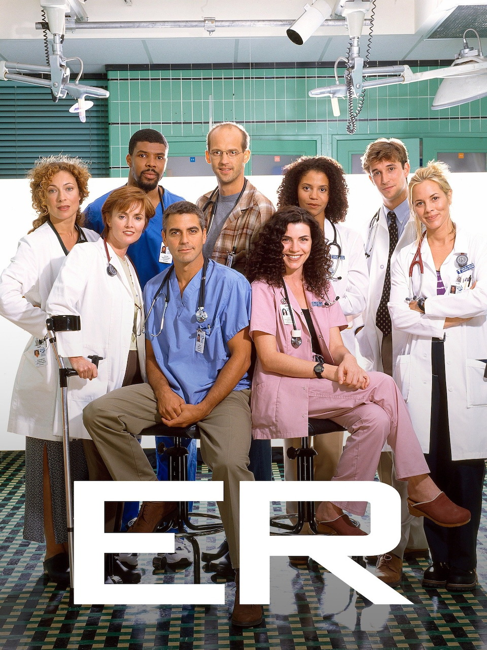 Main cast members of the TV series ER posed together in a group promotional photo.