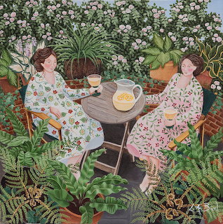 Two women having tea in a verdant garden surrounded by plants and flowers