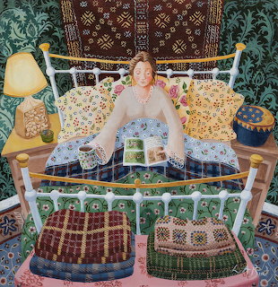 Woman on decorative bed with patterned textiles and ornate furnishings in maximalist bedroom
