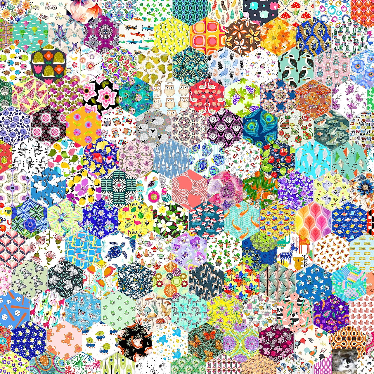Dense mosaic of colorful hexagonal patchwork tiles with varied patterns including florals, dots, and geometric designs