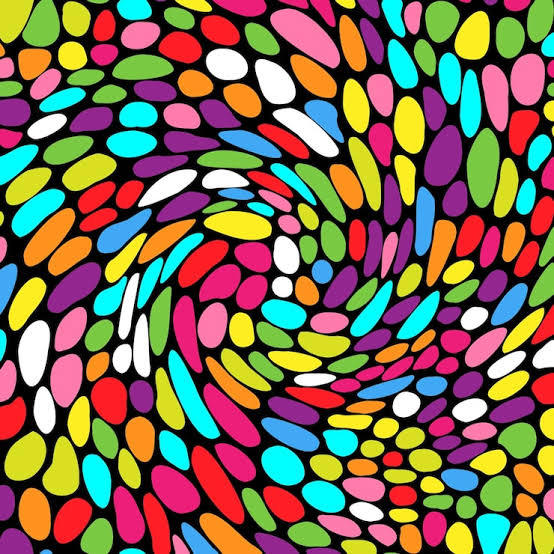 Abstract spiral mosaic pattern with multicolored oval shapes on black background