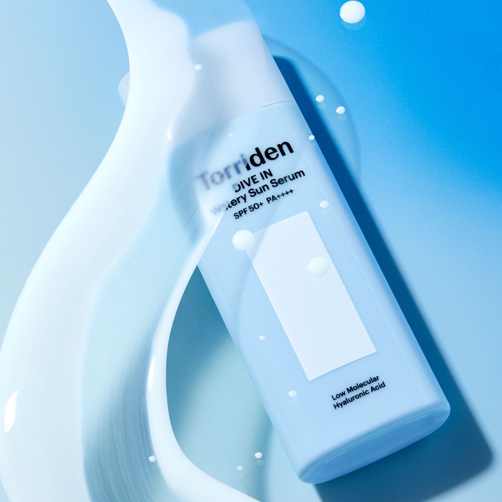 White serum bottle on a blue background with glossy flowing shapes