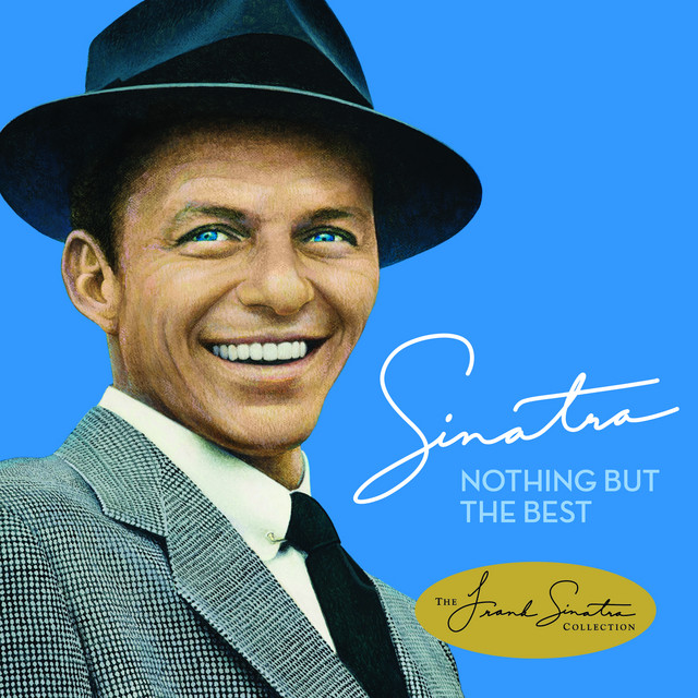 Frank Sinatra smiling in black fedora hat and gray suit with signature on blue background