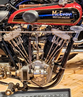 Vintage McEvoy British Anzani V-twin motorcycle engine with exposed pushrods and polished cases