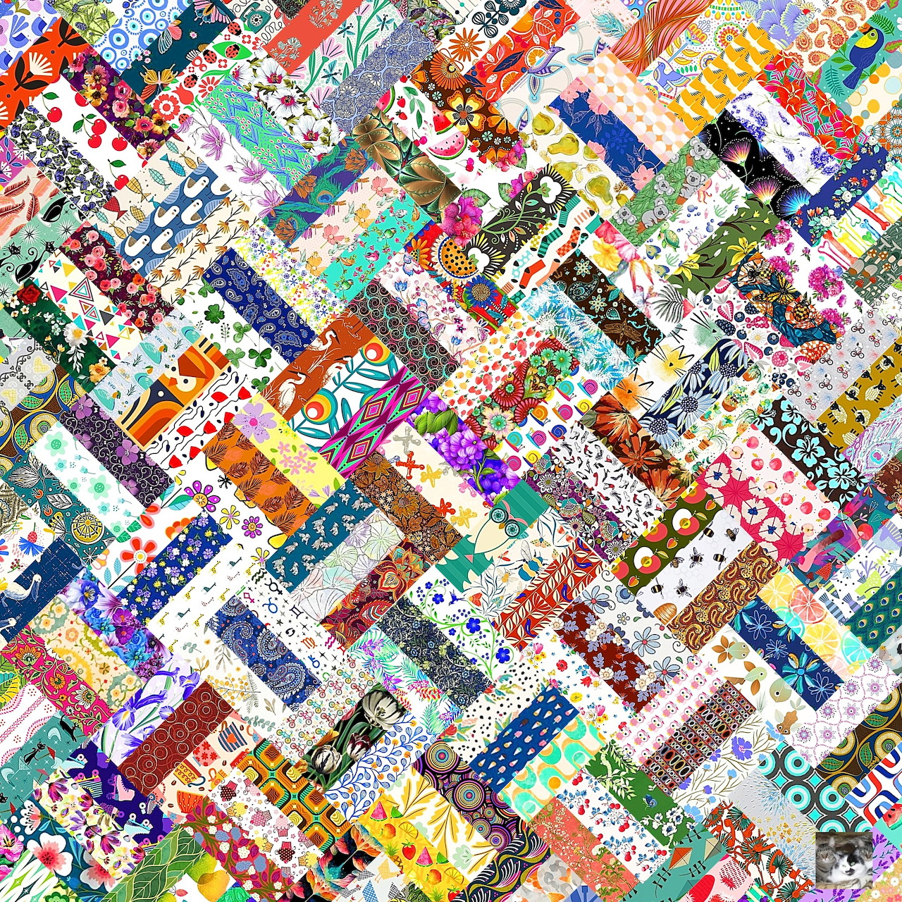 Colorful diagonal patchwork quilt with diverse floral and geometric fabric patterns arranged in chevron strips