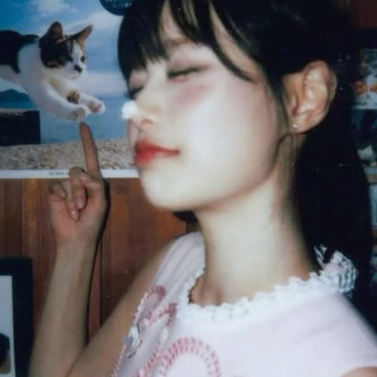 Woman Pointing at Cat