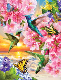 Hummingbirds flying among pink cherry blossoms with butterflies in a bright spring garden