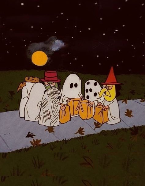 Peanuts characters in ghost and witch costumes with jack-o-lanterns on a blanket under night sky