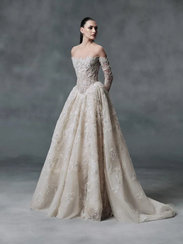 Woman in white bridal gown with lace and embroidered details