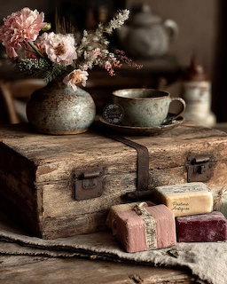 Vintage Suitcase With Soap and Flowers