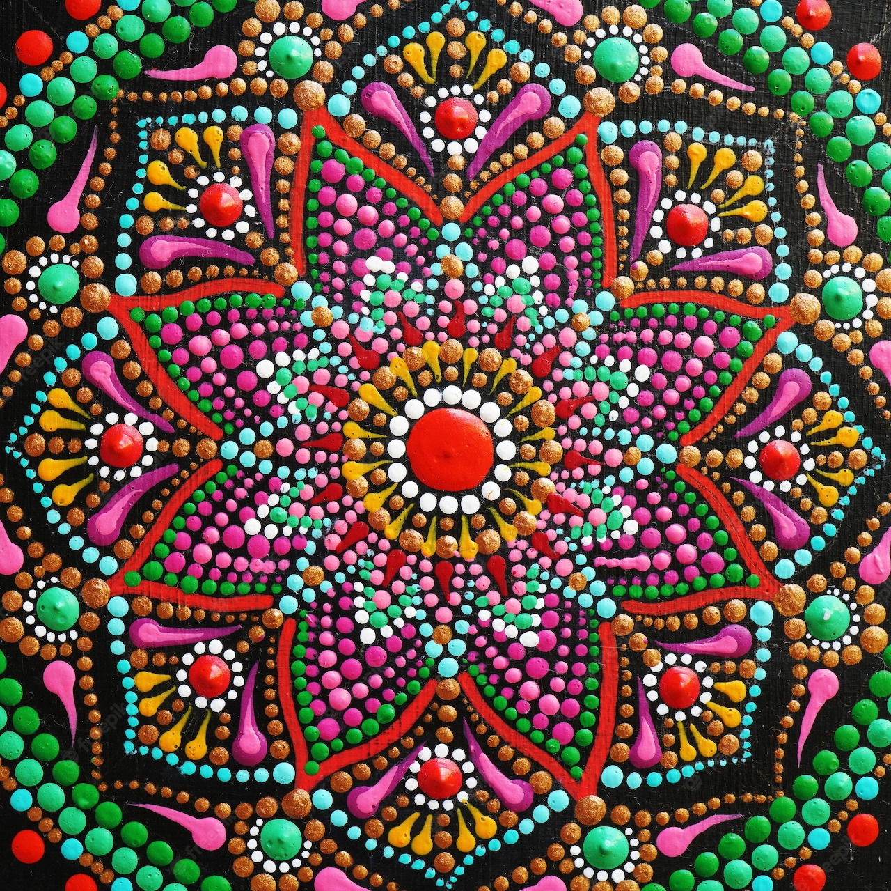 Colorful dot-painted mandala with symmetrical geometric patterns on black background