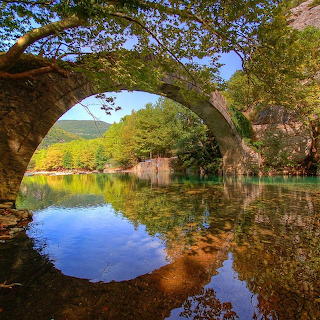 Stone Arch Bridge Over Lake