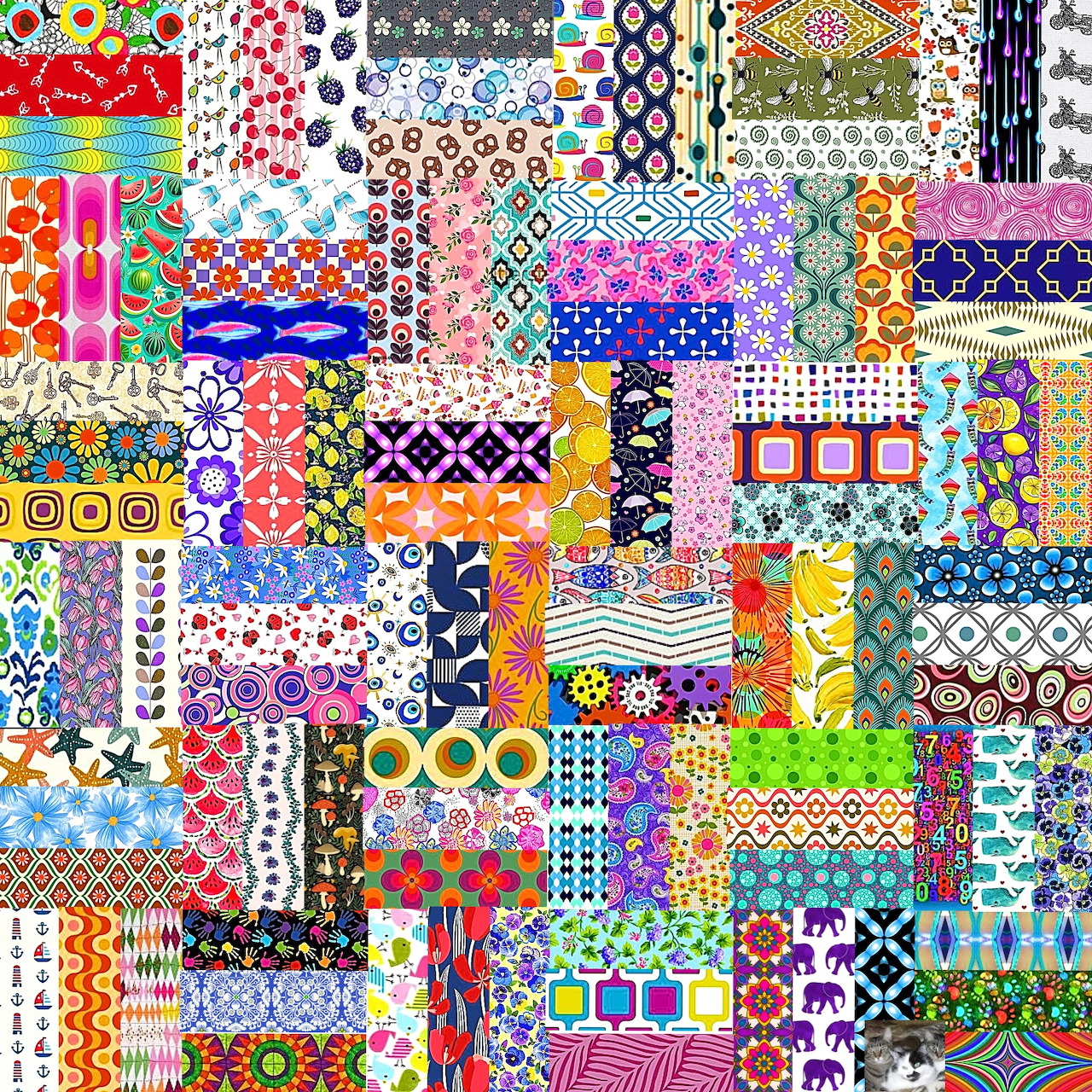 Colorful patchwork quilt with diverse fabric patterns in small squares arranged in a grid