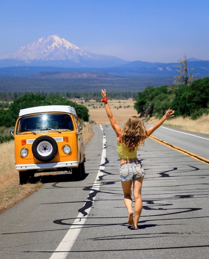 Woman with VW Van Mountain Road