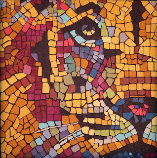 Colorful mosaic portrait of a stylized human face made of small irregular tiles