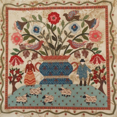 Traditional Dutch folk art quilt with floral vase centerpiece, birds, and costumed figures in decorative border