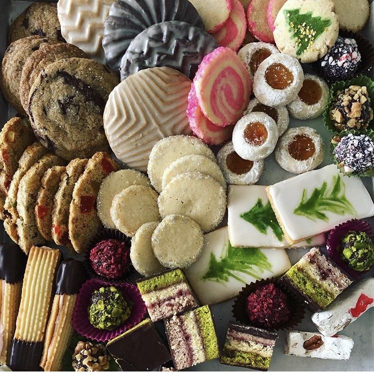 Overhead view of assorted cookies and desserts on platter