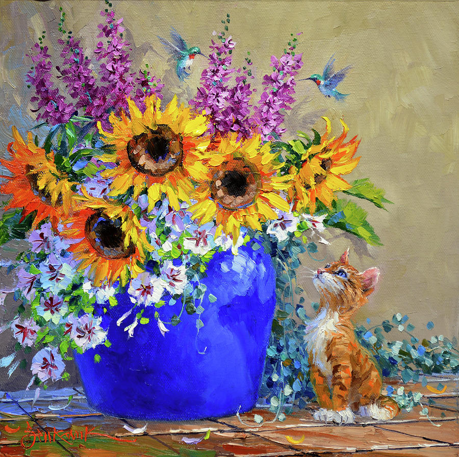 Painting of sunflowers and purple flowers in a blue vase beside a small orange kitten