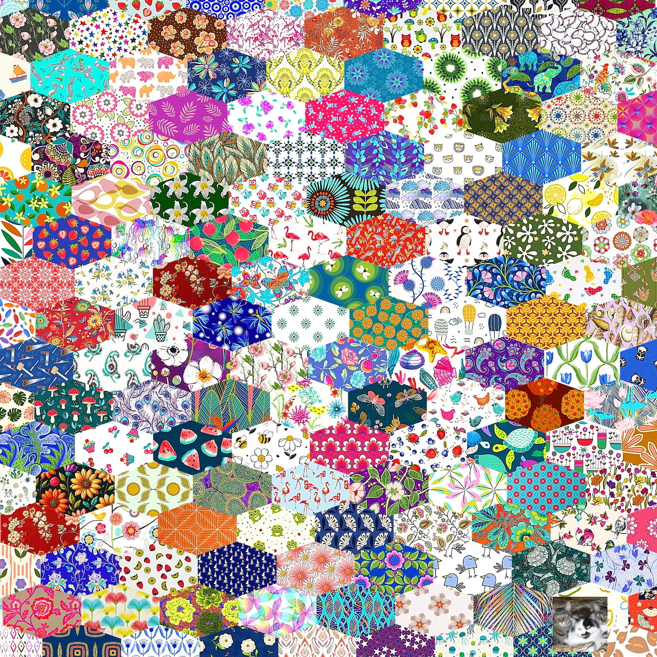 Colorful hexagonal patchwork quilt with diverse patterns and fabrics creating a dense mosaic design