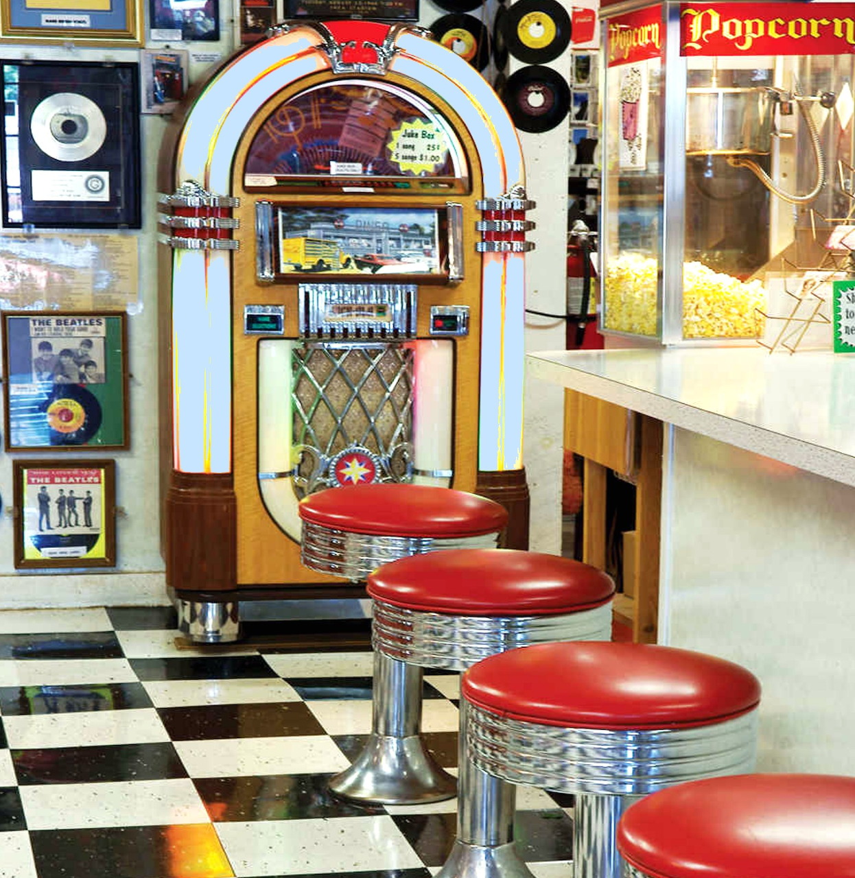 Retro 1950s diner with jukebox, red chrome stools, and black-white checkered floor