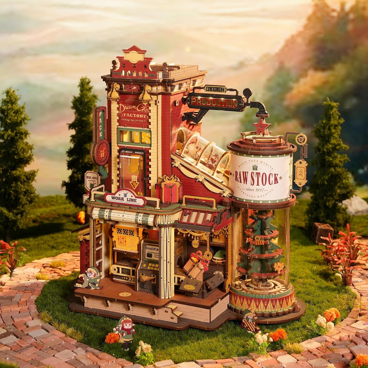 Miniature fantasy factory building with signs, gears, and tiny figures on a garden path