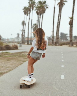 Woman Longboarding at Beach