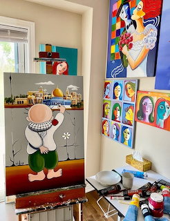 Art studio interior with vibrant paintings on walls and creative workspace