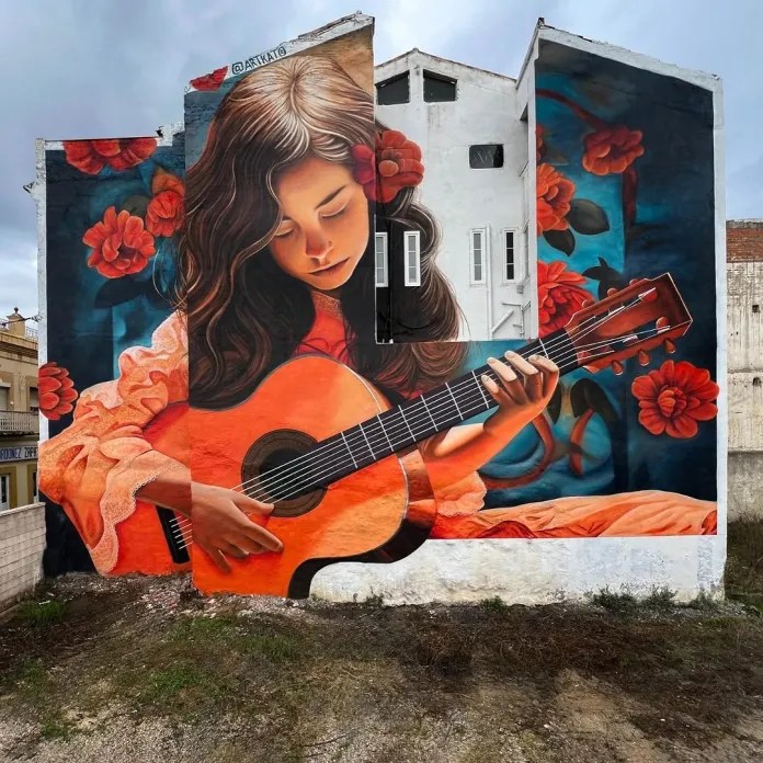 Street art mural showing woman in orange dress playing guitar among red poppies on building facade