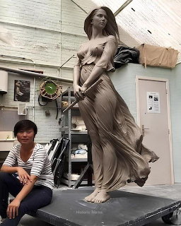 Artist with her work