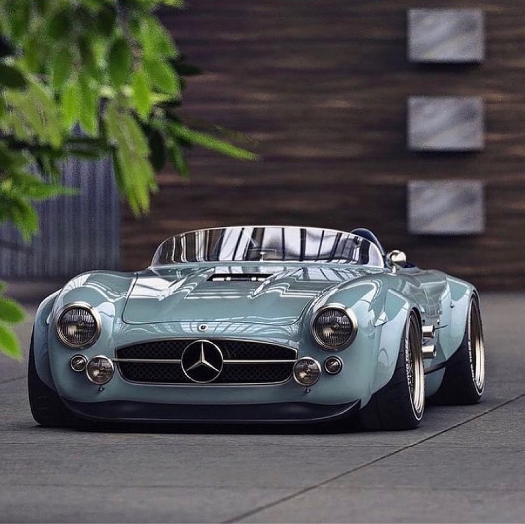 Front view of a low vintage-style Mercedes sports car parked outdoors