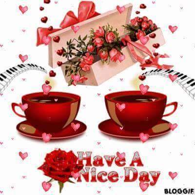 Red coffee cups with roses, hearts, and Have A Nice Day text