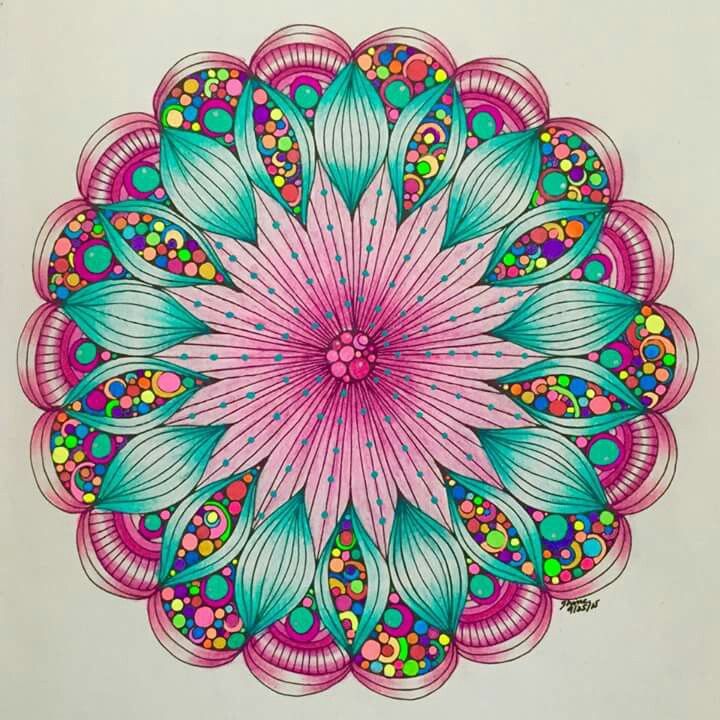 Circular mandala with pink center, turquoise petals, and colorful geometric patterns in symmetrical design
