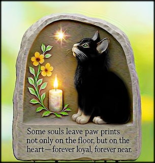 Memorial plaque with black kitten, candle, yellow flowers, and tribute text about loyal pets