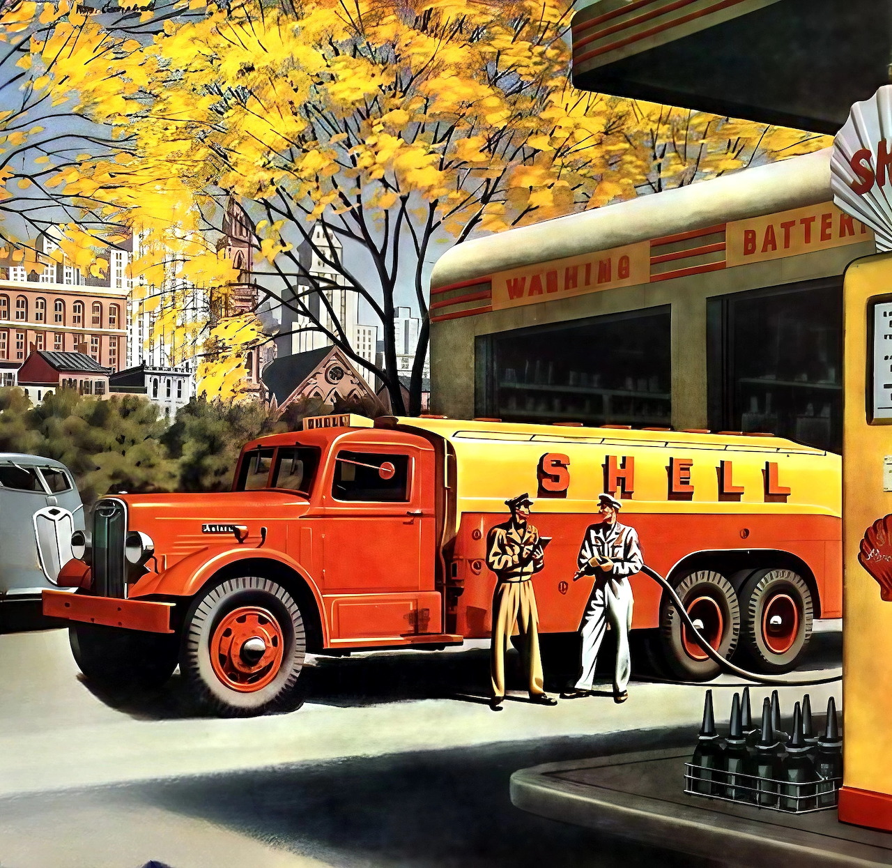 Red vintage oil tanker truck parked at yellow service station with autumn foliage