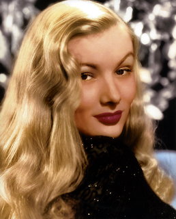 Colorized portrait of Veronica Lake with long blonde wavy hair and red lipstick in1940s glamour style