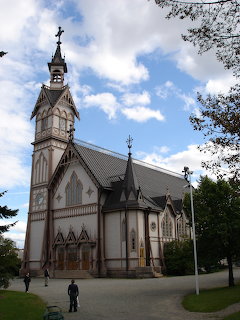 Kajaanin kirkko, a white wooden church with a bell tower in Kajaani, Finland