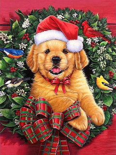 Golden puppy in a Christmas wreath wearing a Santa hat, with a plaid bow and small birds