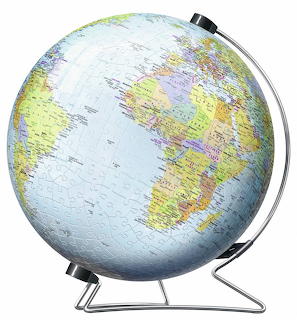 World globe on silver stand showing political map with countries in different colors