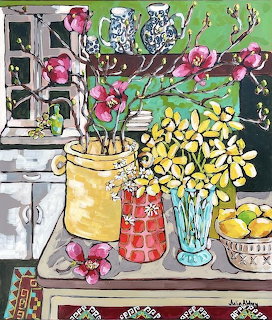 Colorful still life painting with yellow flowers in vases, lemons, and pink blooms by a window